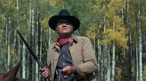 John Wayne as Marshall Reuben J. 'Rooster' Cogburn in True Grit (1969)