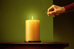lighting a candle - Stephen Swintek/Stone/Getty Images
