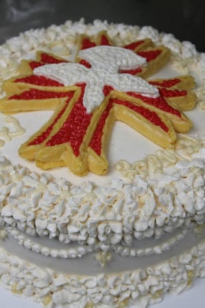 Confirmation cake with a cross and the Holy Spirit.