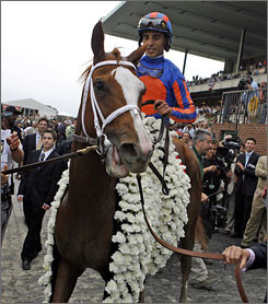 Rags to Riches into the winner's circle at Belmont Park. The horse ...