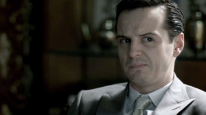 Andrew Scott as James Moriarty in BBC Sherlock in grey suit looking ...