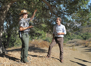 David Szymanski shares some shade with park guide Bethany McCormick.