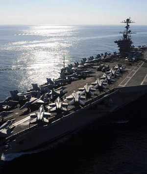 The aircraft carrier USS John C. Stennis transits the Straits of ...