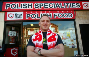 man stands in front of a speciality Polish shop