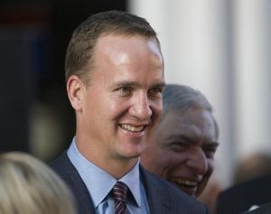 Peyton Manning greets attendees at a fundraiser dinner for School on ...