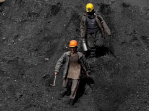 Afghan miners work a coal mine some 60 miles east of the western city ...
