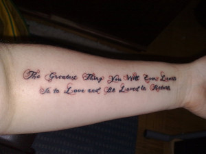 ... in a pattern of brown and black across the arm in this quote tattoo