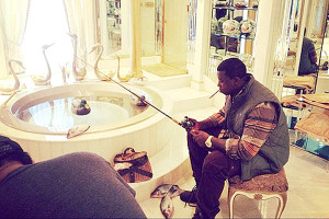 ... think. Pictured: Rapper Gucci Mane is too lazy to actually go fishing