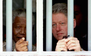 In this file photo, Nelson Mandela, and former US President Bill ...