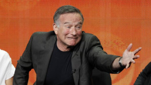 Cast member Robin Williams gestures at a panel for the television ...