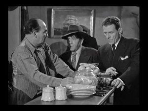 Would-be reporters Moe, Larry and Shemp question the bartender at a ...