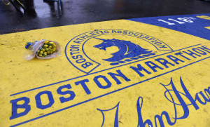 hide caption flowers rest on the finish line of the boston marathon ...
