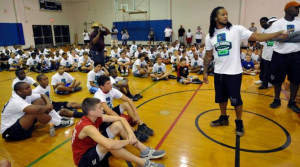Earl Thomas, right, of the Seattle Seahawks, greets the kids at the ...