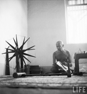 Margaret Bourke-White: Indian leader Mohandas Gandhi reading as he ...