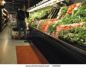 Grocery Store Produce Section Clerk works in produce section
