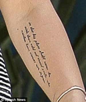 ... Miley Cyrus reveals her new tattoo... a quote from President Roosevelt