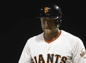 Giants right fielder Hunter Pence reacts after striking out in the ...