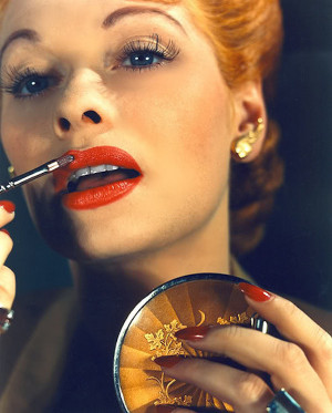 ... , long eyelashes, red lipstick and classic red nails are a staple