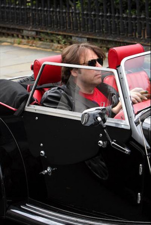 Jonathan Ross smokes a cigar whilst sitting in his car, #London . 11 # ...