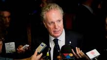 Quebec Premier Jean Charest speaks to reporters at The International ...
