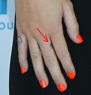 Miley Cyrus Peace Tattoo on Her Finger