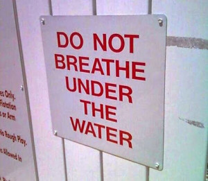 Funny African swimming pool sign notice joke picture - do not breathe ...