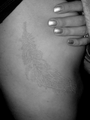 My white ink feather tattoo