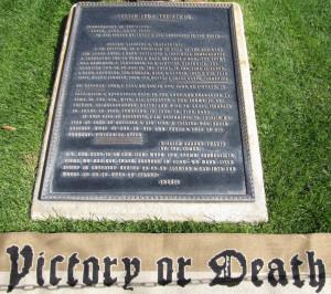 ... or Death” scarf pictured with the plaque in the front of the Alamo