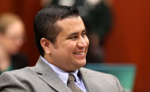 George Zimmerman smiles in response to a juror’s answer during ...