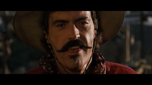 Powers Boothe as Curly Bill Brocius