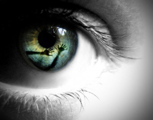 Eye Reflection eerie black and white with colored iris