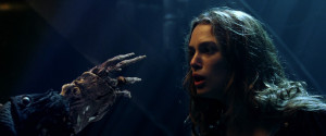 Elizabeth looking at Barbossa's cursed form in the moonlight.
