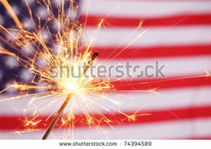sparkler and usa flag showing 4th of july - stock photo