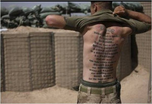 Marines tattoo on his back reads: 