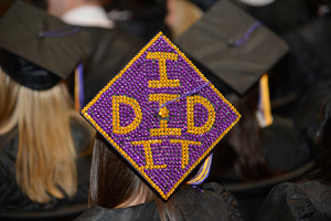 student’s graduation cap loudly proclaims, “I Did It,” at the ...