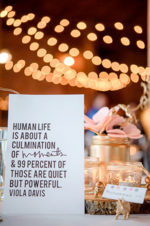 Gold and pink wedding tablescape with love quotes