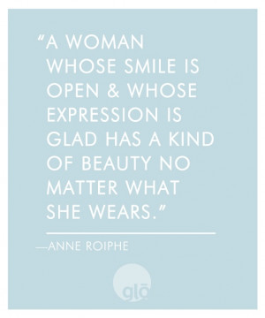 woman whose smile is open and whose expression is glad has a kind of ...