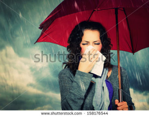 ... Woman with Umbrella over Autumn Rain Background. Sick Woman