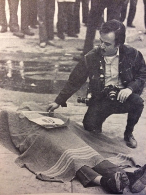 Raul Ruiz of La Raza Newspaper placing flag over the Martyrs of the ...