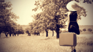 young-woman-with-suitcase-in-a-country.jpg