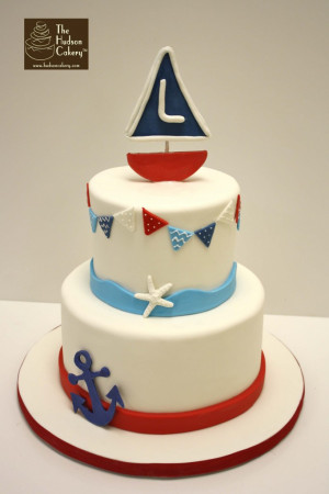 Monogrammed sailboat cake for a boy’s birthday party