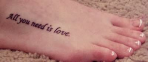 tattoostime.comLove quote Tattoo On Foot