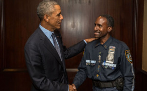 President Barack Obama greets Clarence Baugh, an NYPD tow truck driver ...