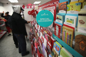 Customers choose cards and gifts on Valentine's Day. (John Moore ...