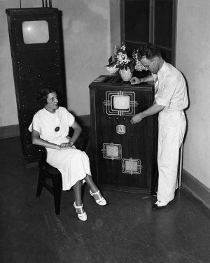 Mabel Bernstein watches as Philo T. Farnsworth tunes the combination ...