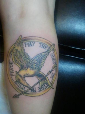 Previous Another Hunger Games fan gets a mockingjay and the quote 'May ...