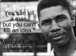 Medgar Evers stands near a sign of the state of Mississippi in 1958 ...