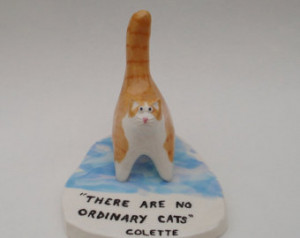 ceramic cat sculpture with Colette quote: 