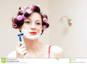 ... Stock Images: Beautiful funny girl shaving with foam & razor her face