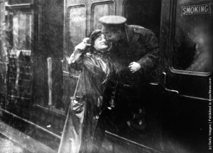 ... in the rain at Victoria station, London, as he leaves for the front